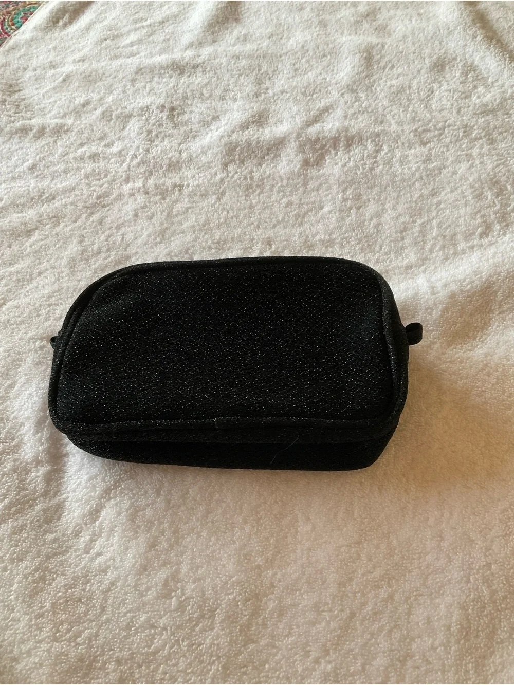 CHANEL Black Cosmetic Pouch with Gold Logo and Camellia Accents